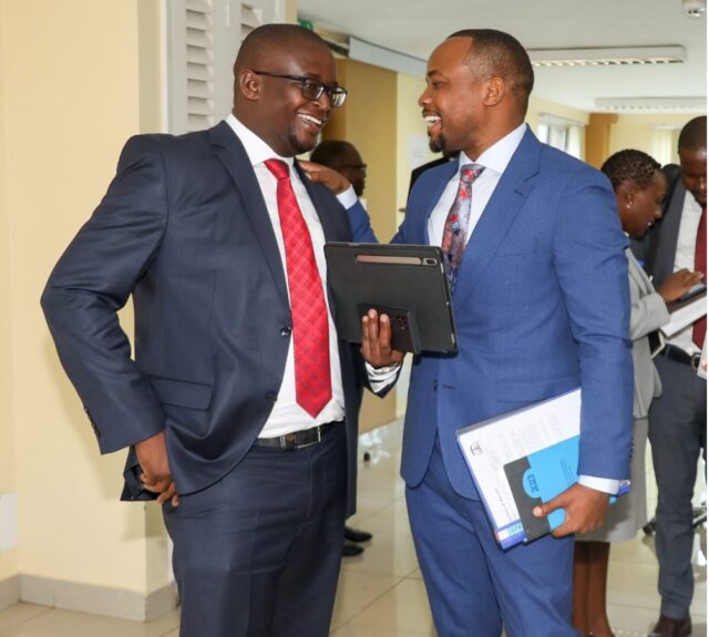 PS Korir (R) chatting with LSK President Eric Theuri after a stakeholders meeting (FILE)