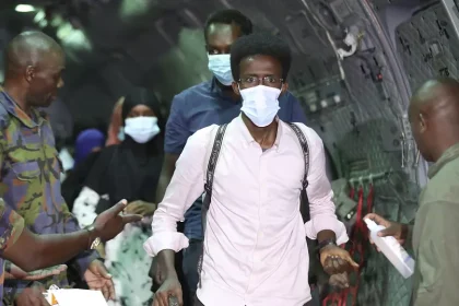 Dozens of evacuees disembark from a Kenya Air Force plane, and were received by Defence Secretary Aden Duale (FILE)