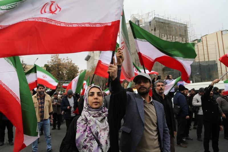People attend a protest against US -Israeli attacks on Iran, in Tehran (Xinhua)