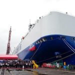 Guests pose for a group photo at the delivery ceremony of car carrier Glovis Leader in Guangzhou, south China's Guangdong Province, April 28, 2026. (Xinhua/Wu Lu)