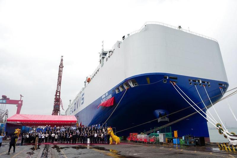 Guests pose for a group photo at the delivery ceremony of car carrier Glovis Leader in Guangzhou, south China's Guangdong Province, April 28, 2026. (Xinhua/Wu Lu)