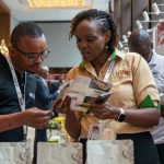 Participants learn about Kenyan coffee at the exhibition of the China-Kenya Business Forum held in Nairobi, Kenya, March 23, 2026. (Xinhua/Xie Jianfei)