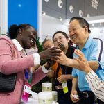 An exhibitor (L) communicates with visitors during the fourth China-Africa Economic and Trade Expo at Changsha International Convention and Exhibition Center in Changsha, central China's Hunan Province, June 13, 2025. (Xinhua/Chen Sihan)