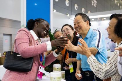An exhibitor (L) communicates with visitors during the fourth China-Africa Economic and Trade Expo at Changsha International Convention and Exhibition Center in Changsha, central China's Hunan Province, June 13, 2025. (Xinhua/Chen Sihan)