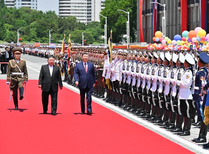 Xi Jinping, general secretary of the Communist Party of China Central Committee and Chinese president, accompanied by Kim Jong Un, general secretary of the Workers' Party of Korea and president of the State Affairs of the Democratic People's Republic of Korea (DPRK), inspects the honor guard of the three services of the Korean People's Army in Pyongyang, the DPRK, June 8, 2026. Kim held a grand welcome ceremony for Xi at Kim Il Sung Square in Pyongyang. (Xinhua/Zhai Jianlan)