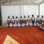 First Lady Rachel Ruto (left) listening to girls